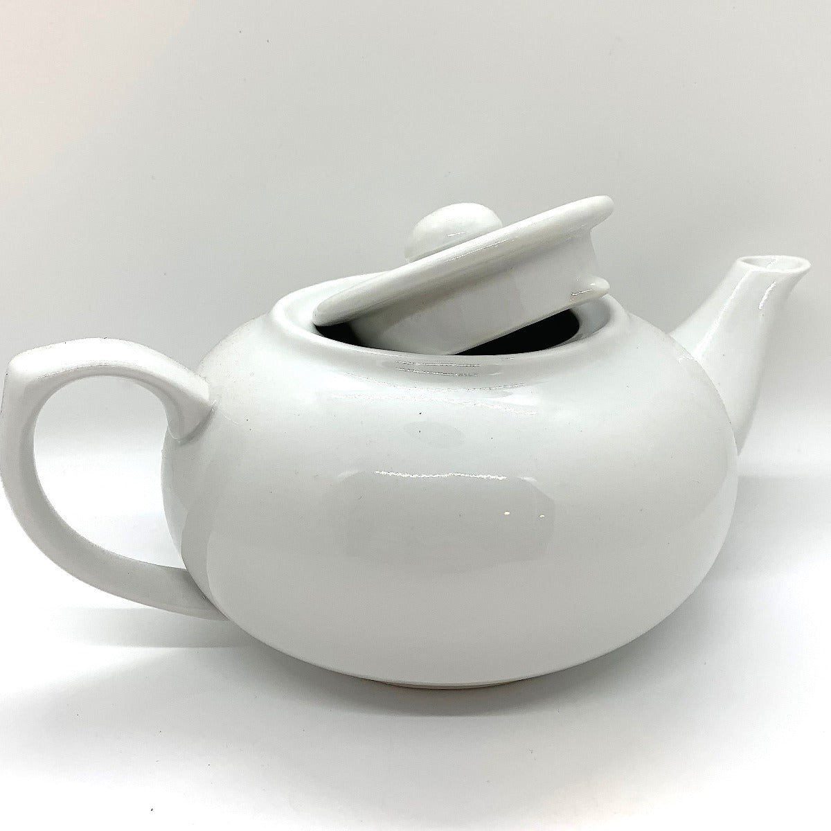 Porcelain Teapot, lid askew Em's Herbals